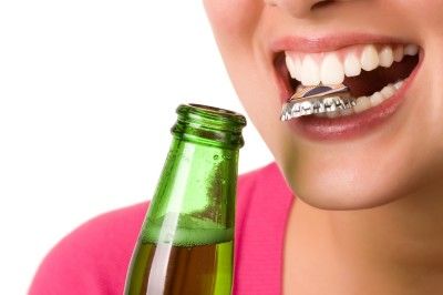 opening bottle with teeth
