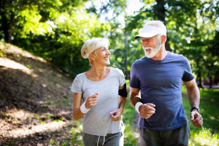 Senior couple jogging to lose weight